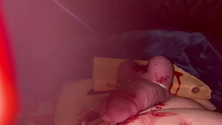 Scrotum Nailed to a Board and Urethra Punctured