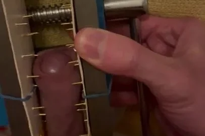 Dick caught in a spiked vice | PenisCrush.com
