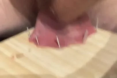 Slave nailing his balls to a board and cumming | PenisCrush.com