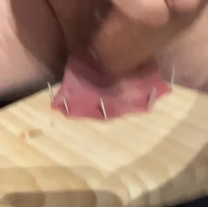 Slave nailing his balls to a board and cumming | PenisCrush.com
