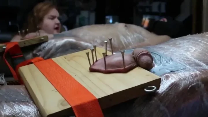 Dozens of Nails Penetrating Scrotum | PenisCrush.com